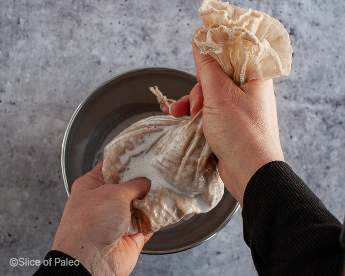 Homemade Unsweetened Almond Milk squeezing nut bag