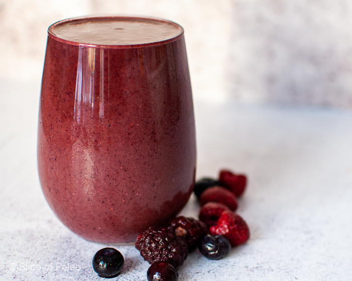 Easy Mixed Berry Spinach Banana Smoothie served in a glass