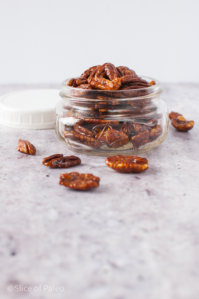 Honey Candied Pecans Spilling Out Of A Jar