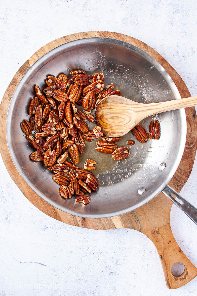 Honey Candied Pecans Cooking In A Skillet