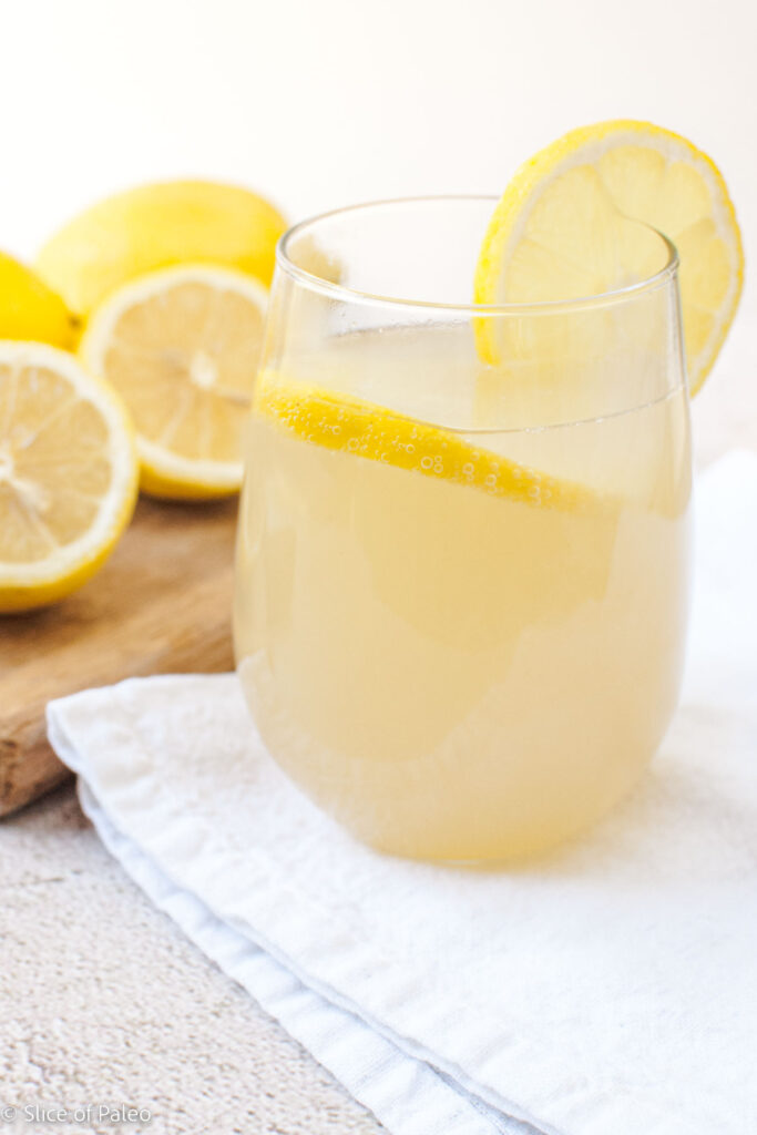Refreshing Lemon Juice Apple Cider Vinegar and Honey Sparkling Beverage served in a clear glass with lemon