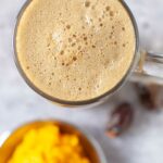 Paleo pumpkin spice latte in a glass mug