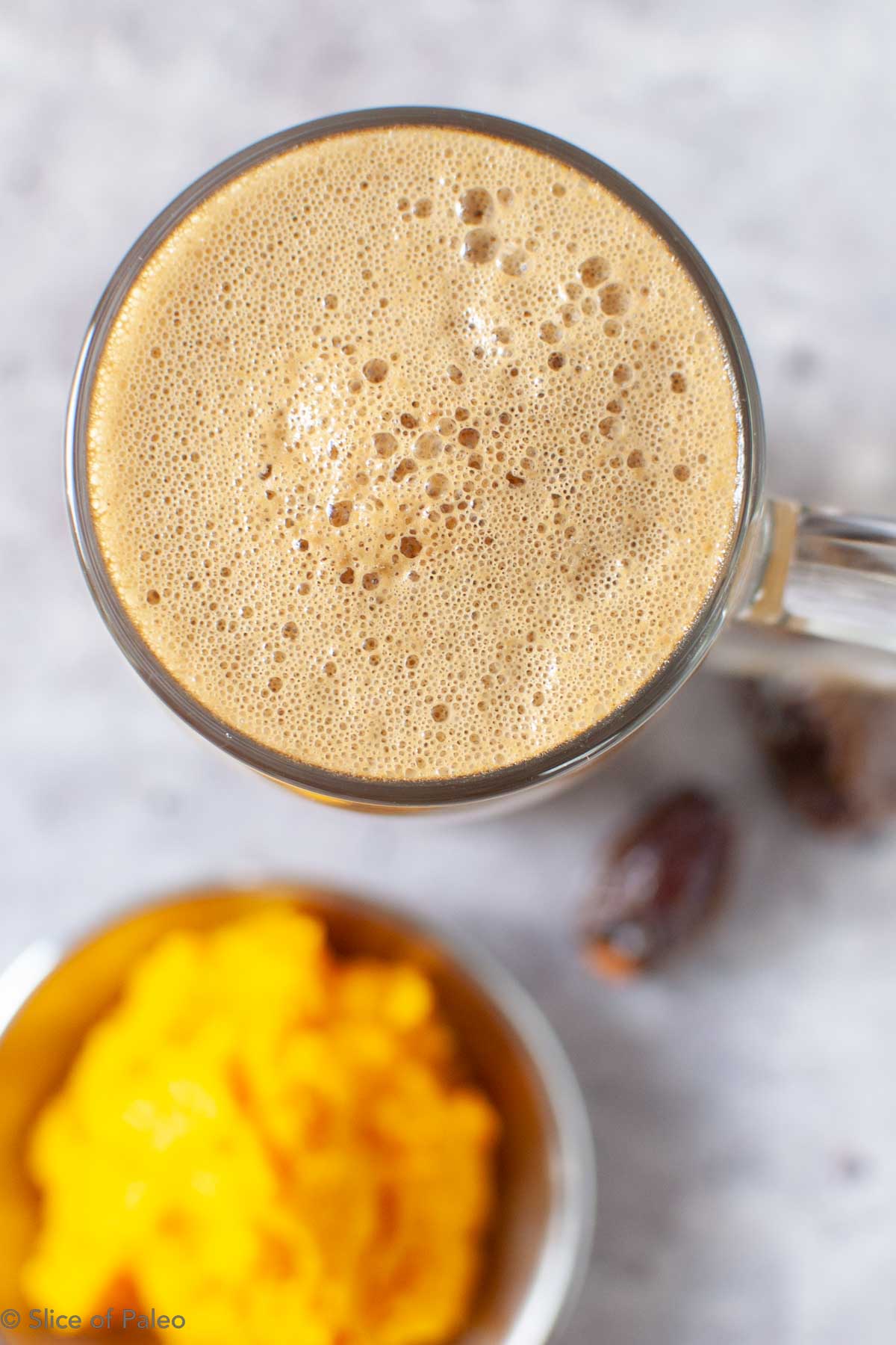 Paleo pumpkin spice latte in a glass mug