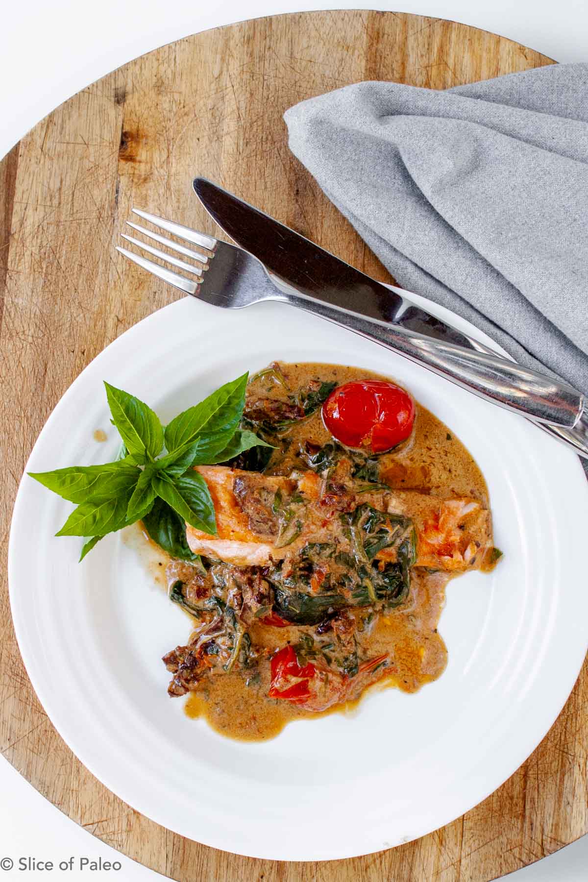Paleo Tuscan Salmon served on a white plate