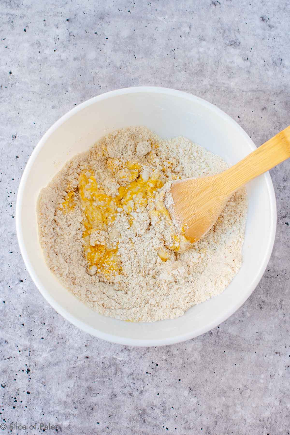 Paleo Biscuits ingredients being stirred in a bowl