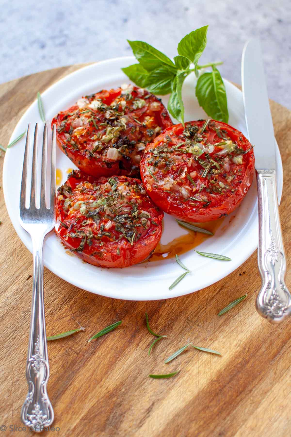 Provencal Tomatoes served on a white plate