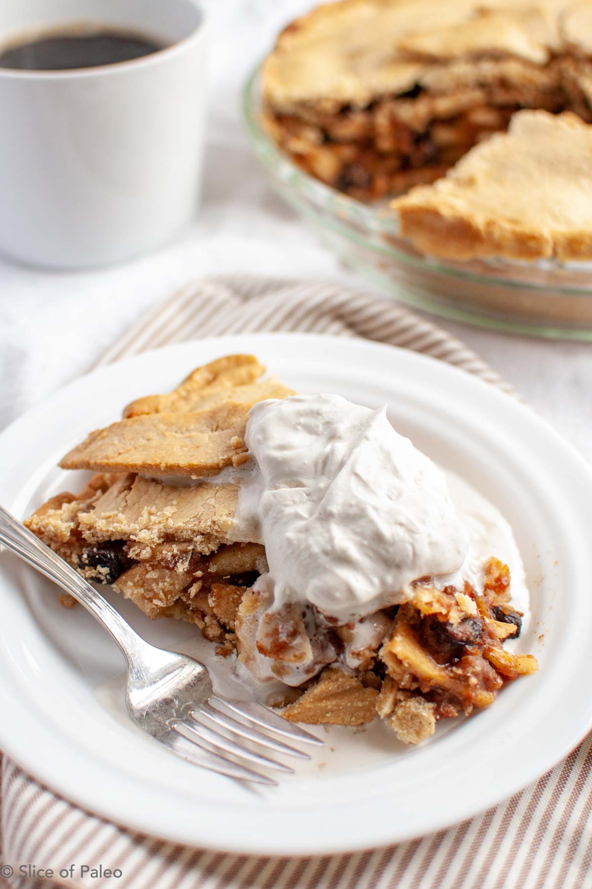 Fruit Sweetened Paleo Apple Pie served with coconut milk whipped cream