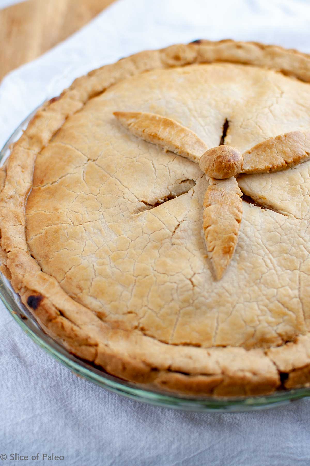 Fruit Sweetened Paleo Apple Pie with browned top crust