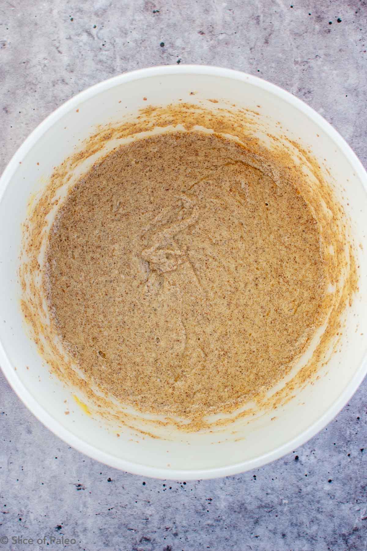 Paleo Chocolate Chip Cookies wet ingredients in a bowl