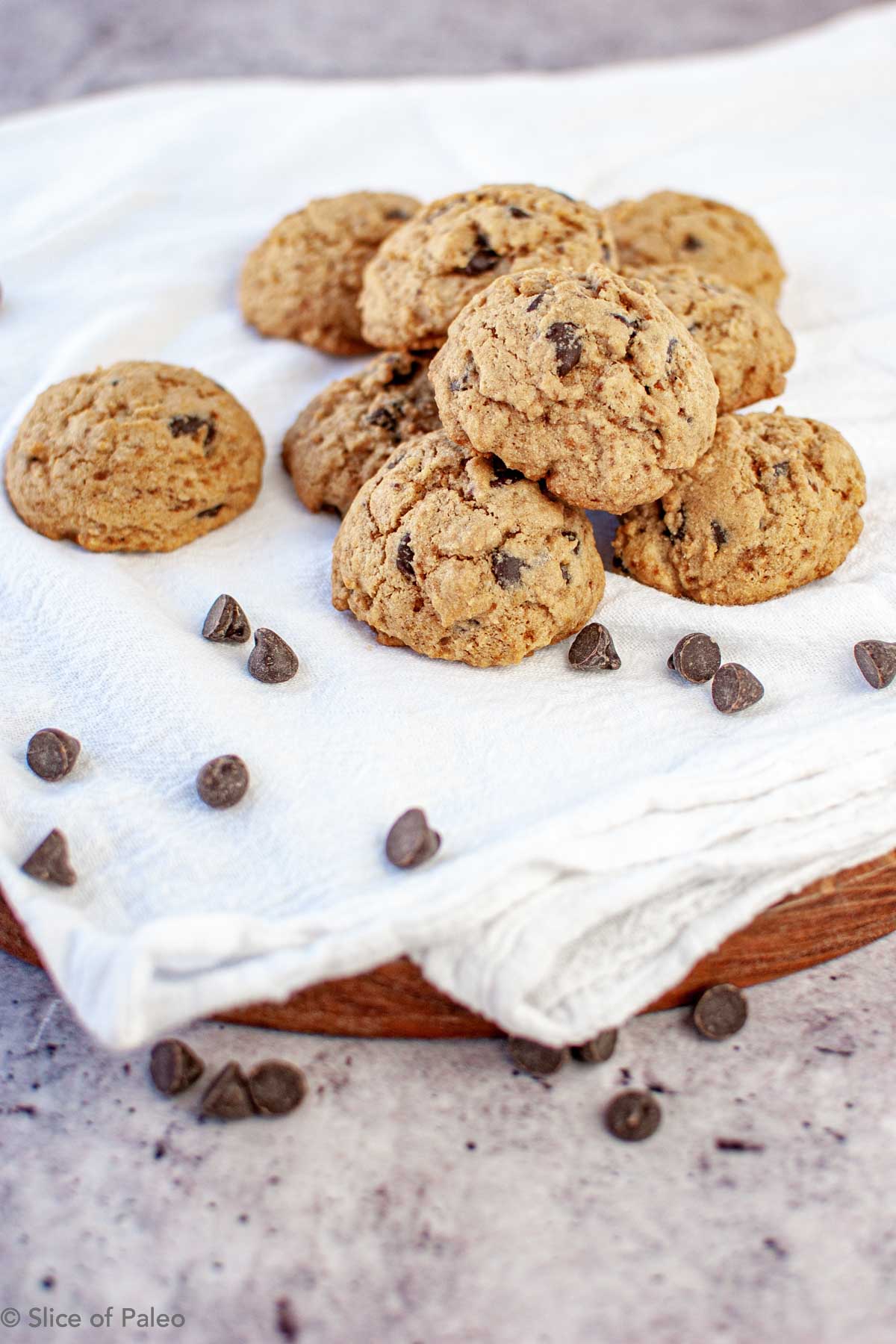 Paleo Chocolate Chip Cookies piled on a dish towel