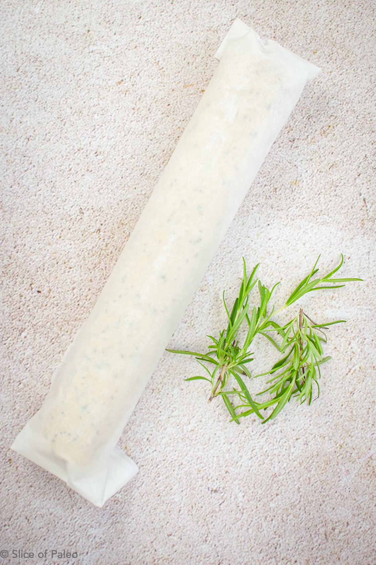 Paleo Rosemary Shortbread dough wrapped in parchment paper