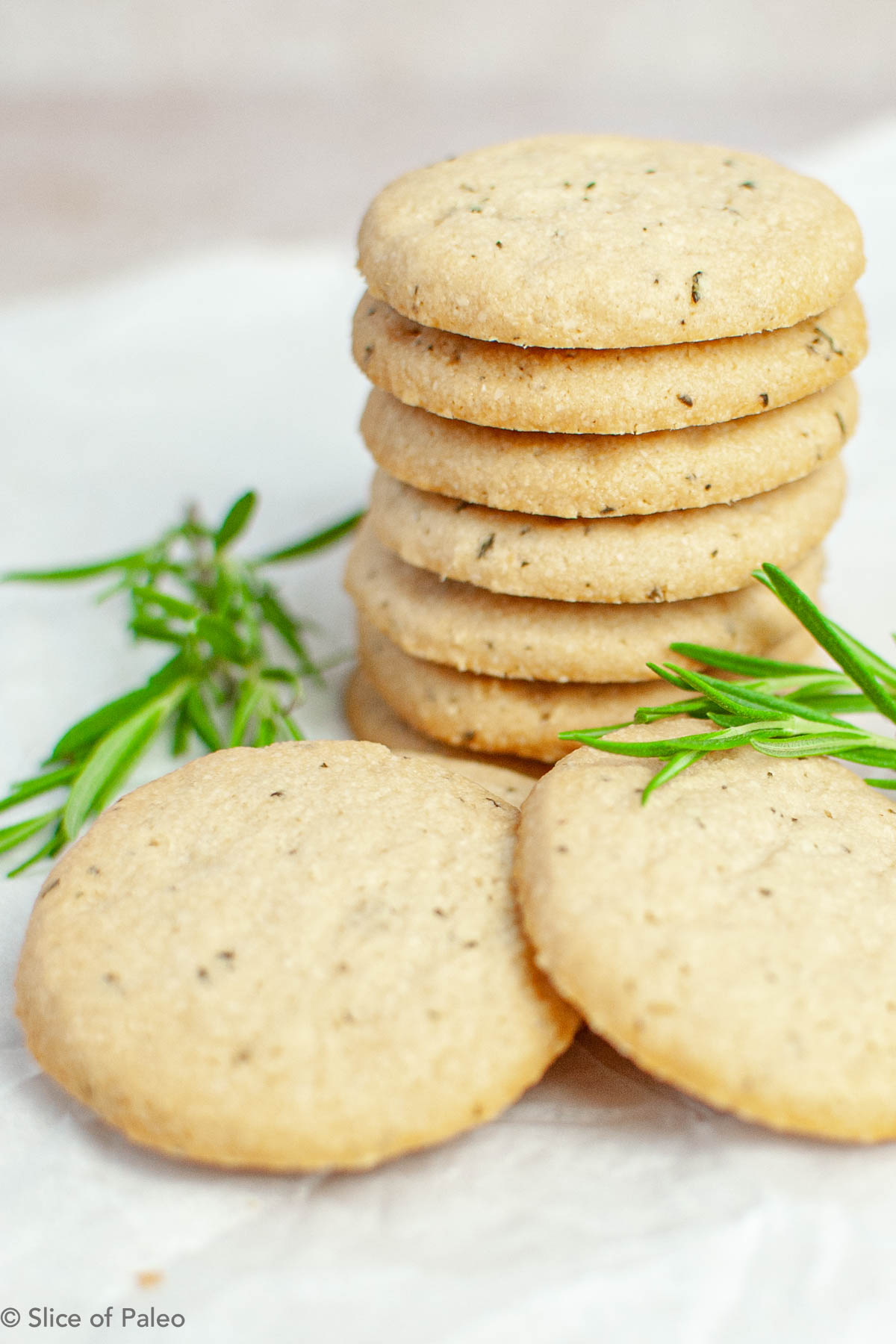 Paleo Rosemary Shortbread stacked on parchment paper