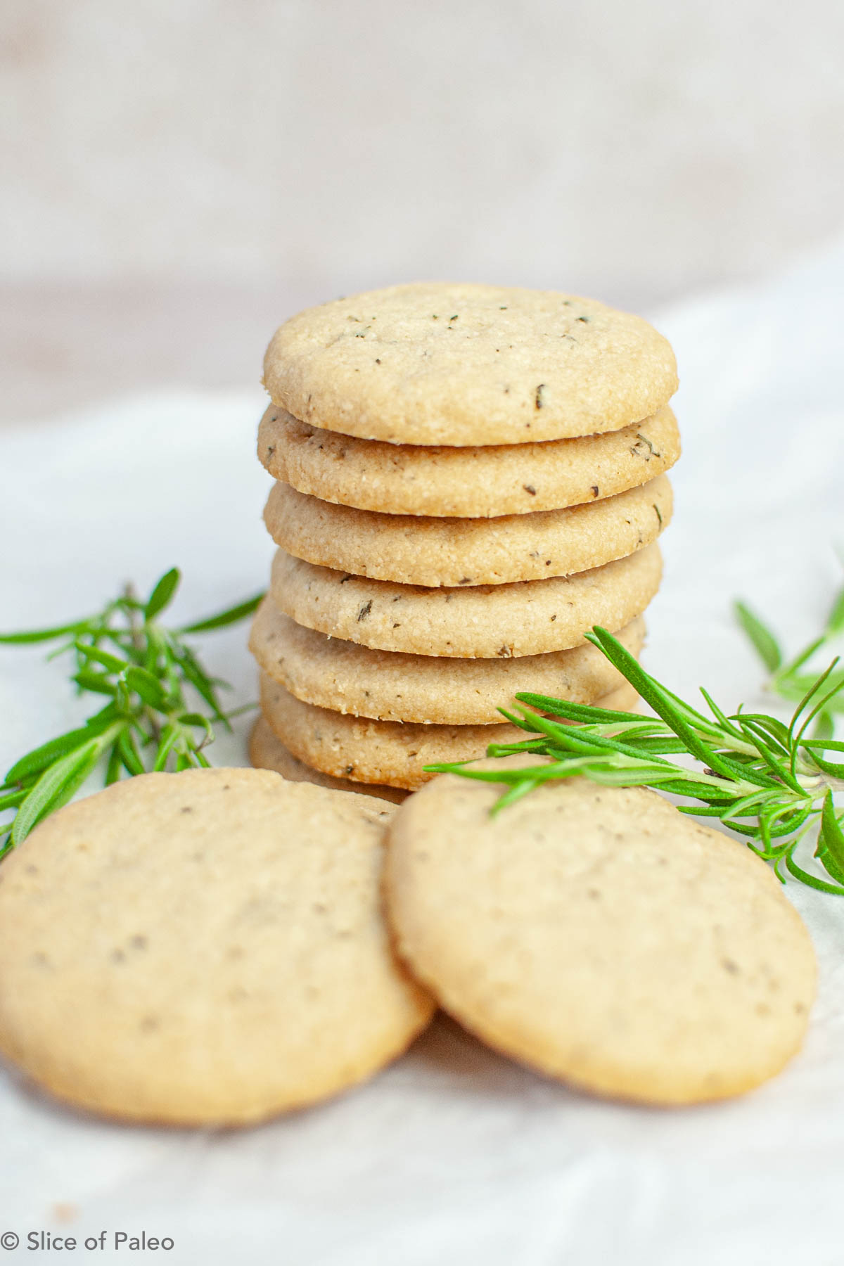 Paleo Rosemary Shortbread shown with fresh rosemary