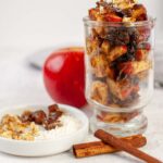 Apple Raisin Almond Butter Compote served in a clear glass
