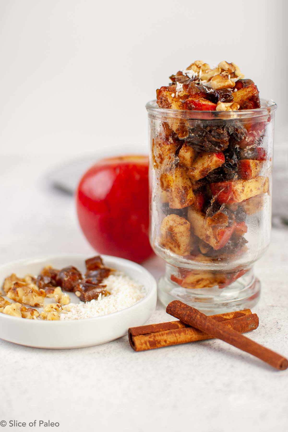 Apple Raisin Almond Butter Compote served in a clear glass