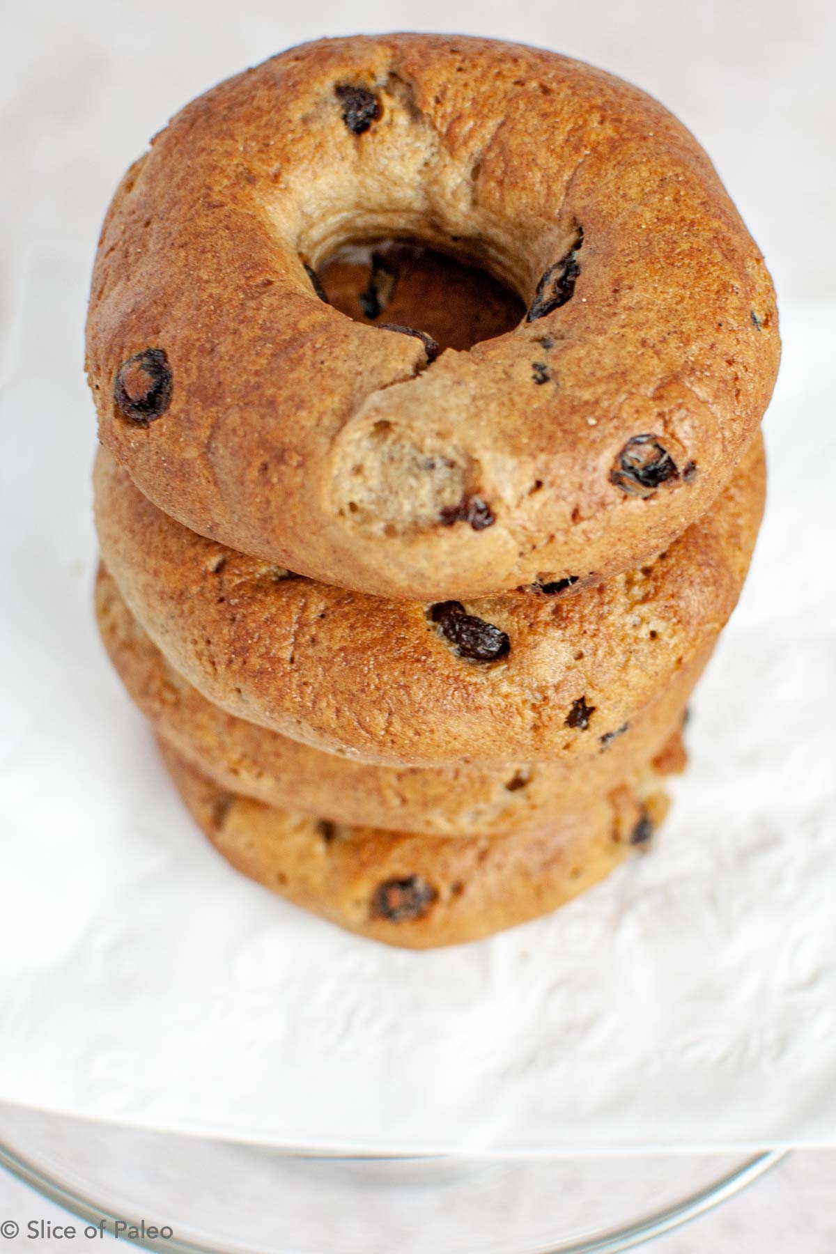 Paleo Cinnamon Raisin Bagels stacked on a plate