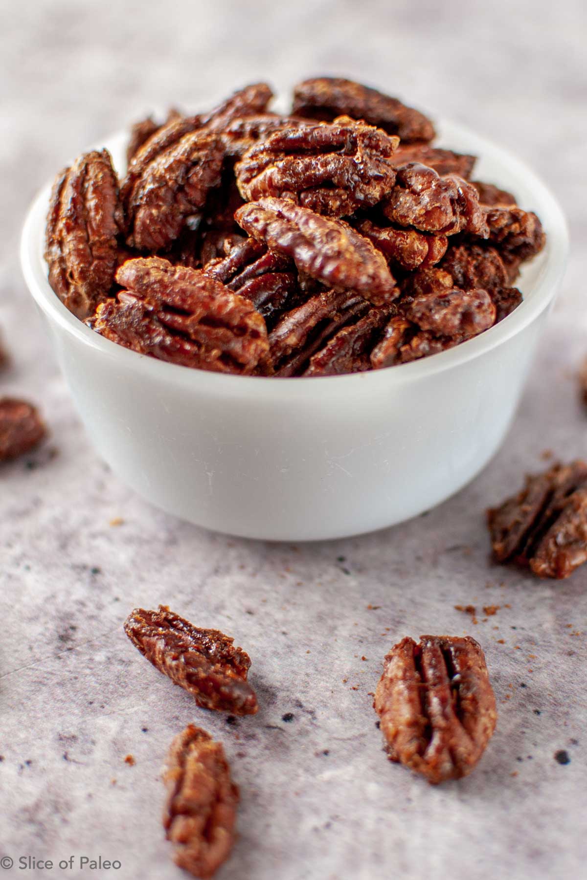 Coconut Sugar Candied Pecans in a white bowl
