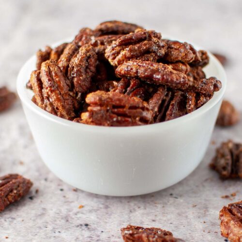 Coconut Sugar Candied Pecans served in a white bowl