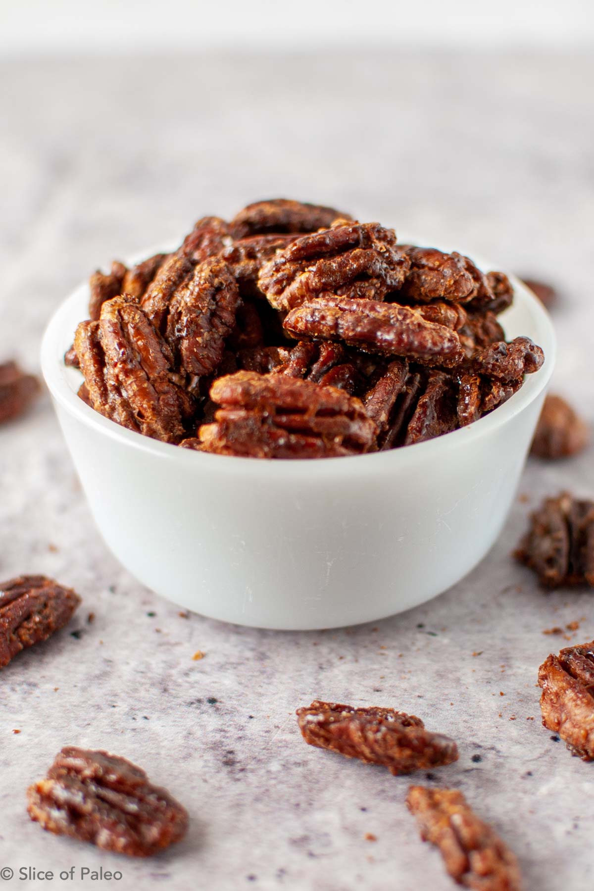 Coconut Sugar Candied Pecans served in a white bowl