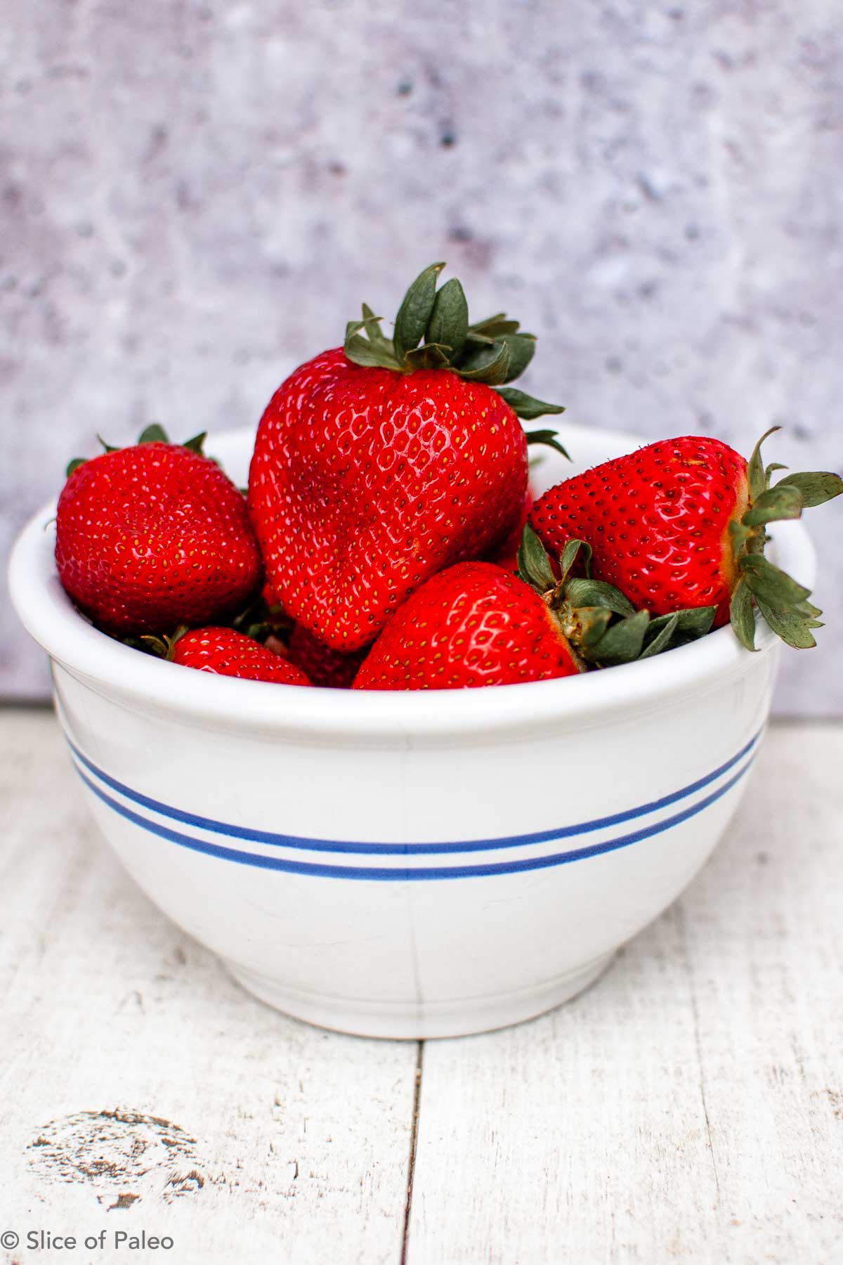 Strawberries in a bowl for paleo strawberry fool recipe