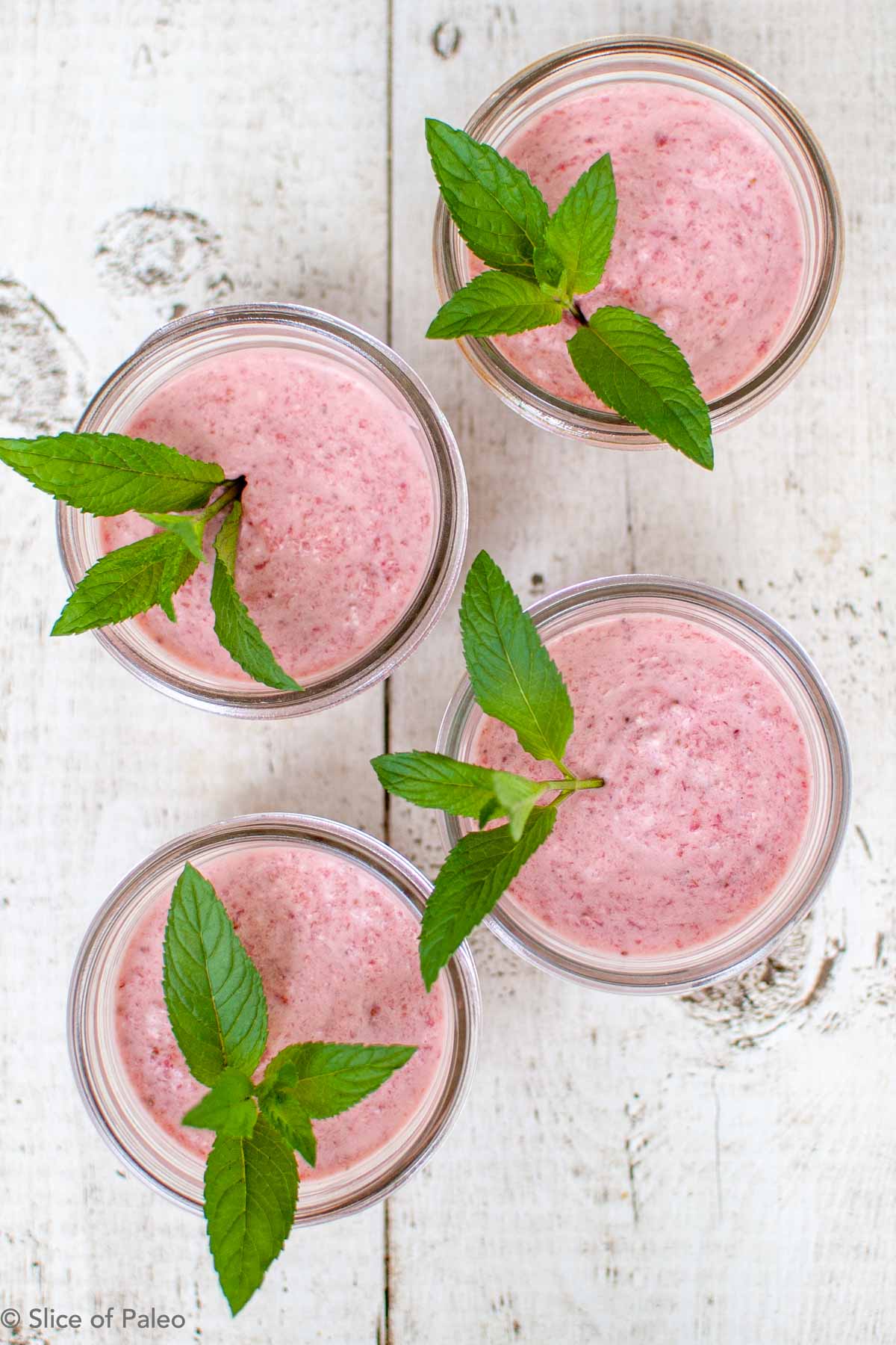 Paleo Strawberry Fool with fresh mint served in ball jars